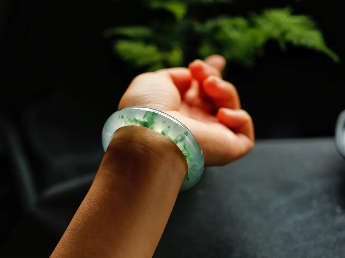 Natural Burmese jadeite bangle with floating green pattern and translucent texture — view 2