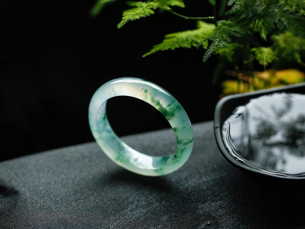 Natural Burmese jadeite bangle with floating green pattern and translucent texture — view 4