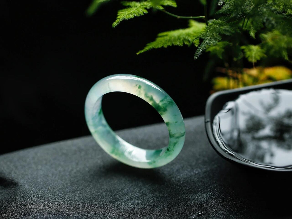 Natural Burmese jadeite bangle with floating green pattern and translucent texture — view 4