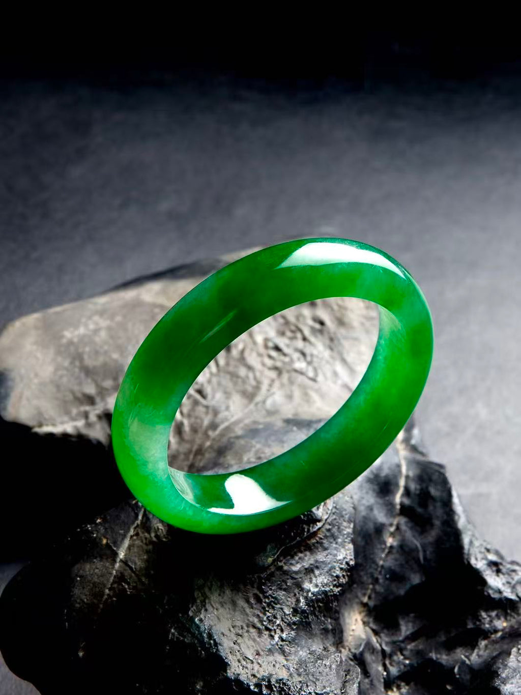 Natural Burmese jadeite bangle in vivid green with translucent texture — view 3