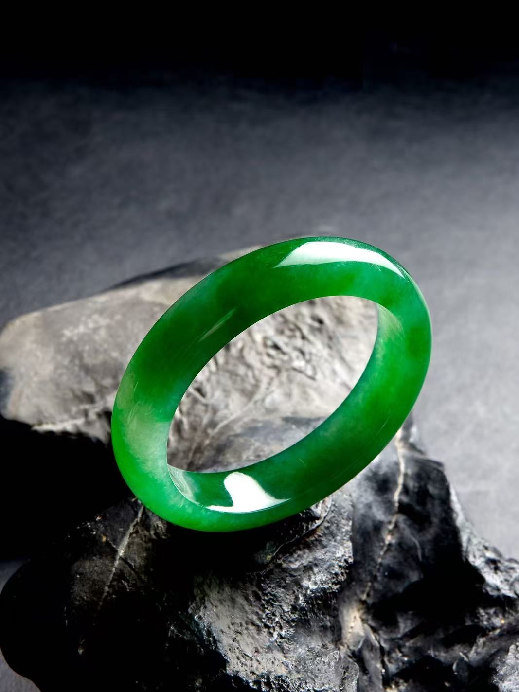 Natural Burmese jadeite bangle in vivid green with translucent texture — view 3
