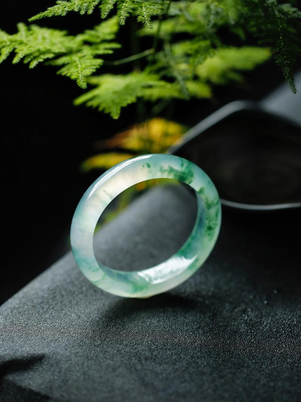 Natural Burmese jadeite bangle with floating green pattern and translucent texture — view 3