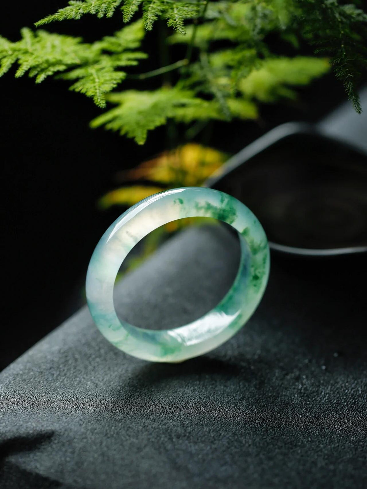 Natural Burmese jadeite bangle with floating green pattern and translucent texture — view 3