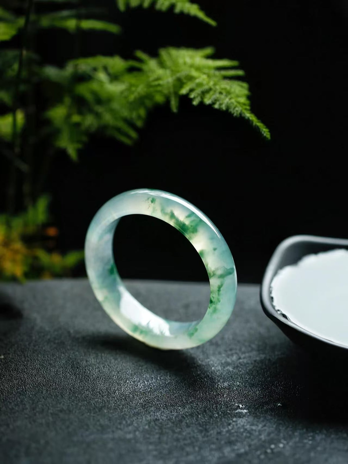 Natural Burmese jadeite bangle with floating green pattern and translucent texture — view 1