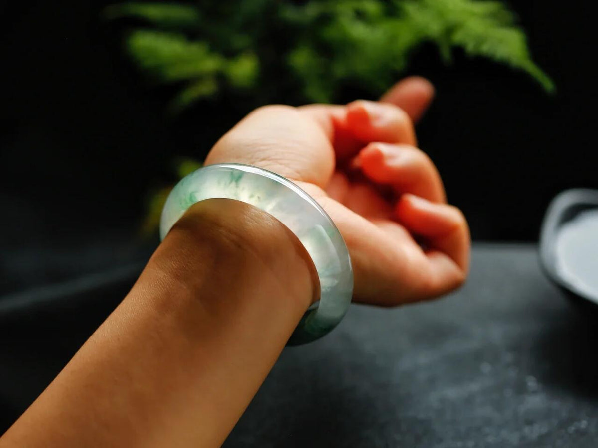 Natural Burmese jadeite bangle with floating green pattern and translucent texture — view 5