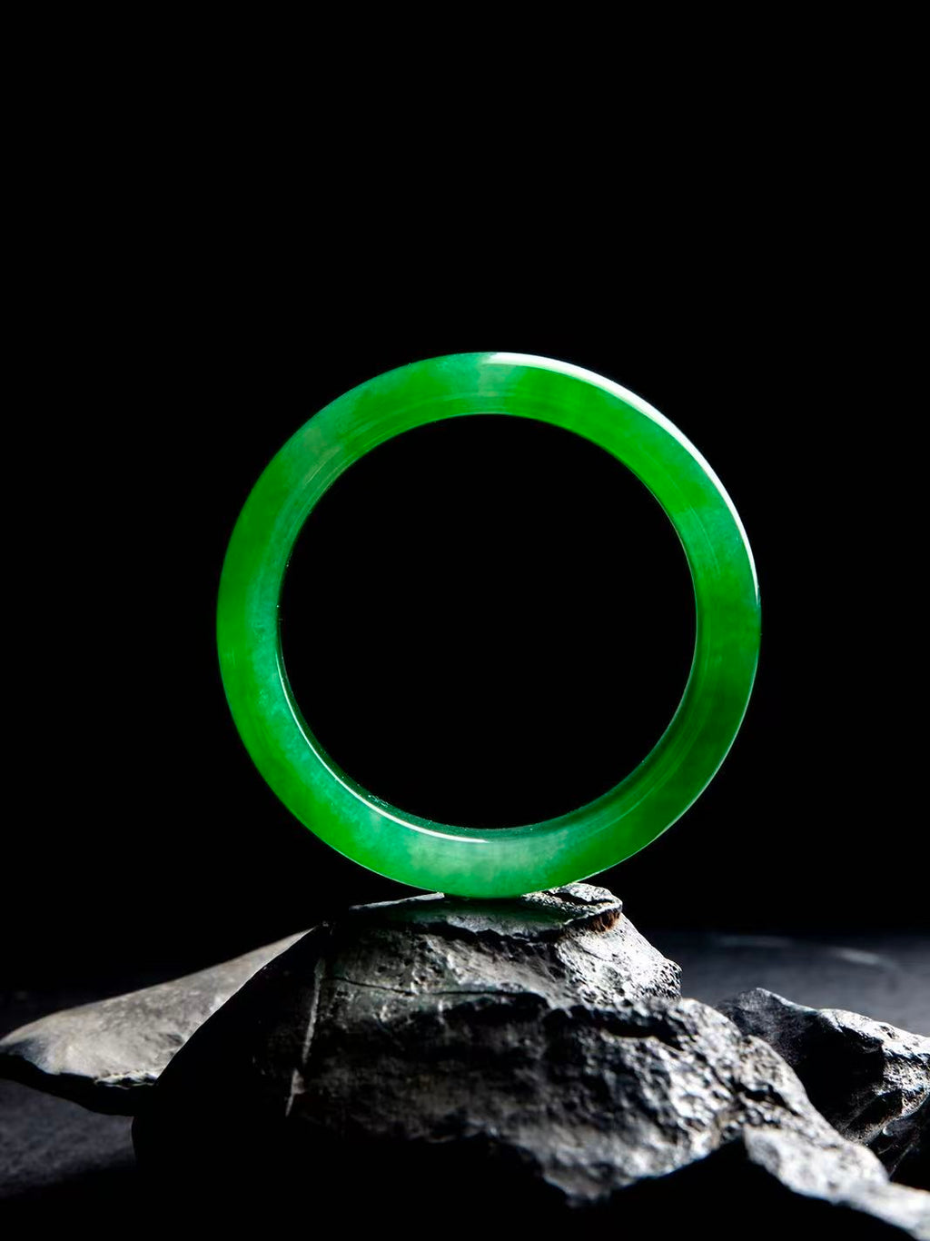 Natural Burmese jadeite bangle in vivid green with translucent texture — view 4