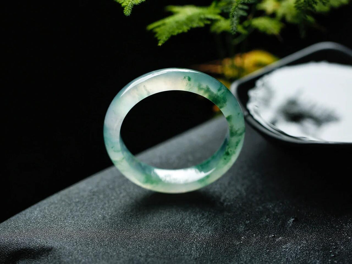 Natural Burmese jadeite bangle with floating green pattern and translucent texture — view 6