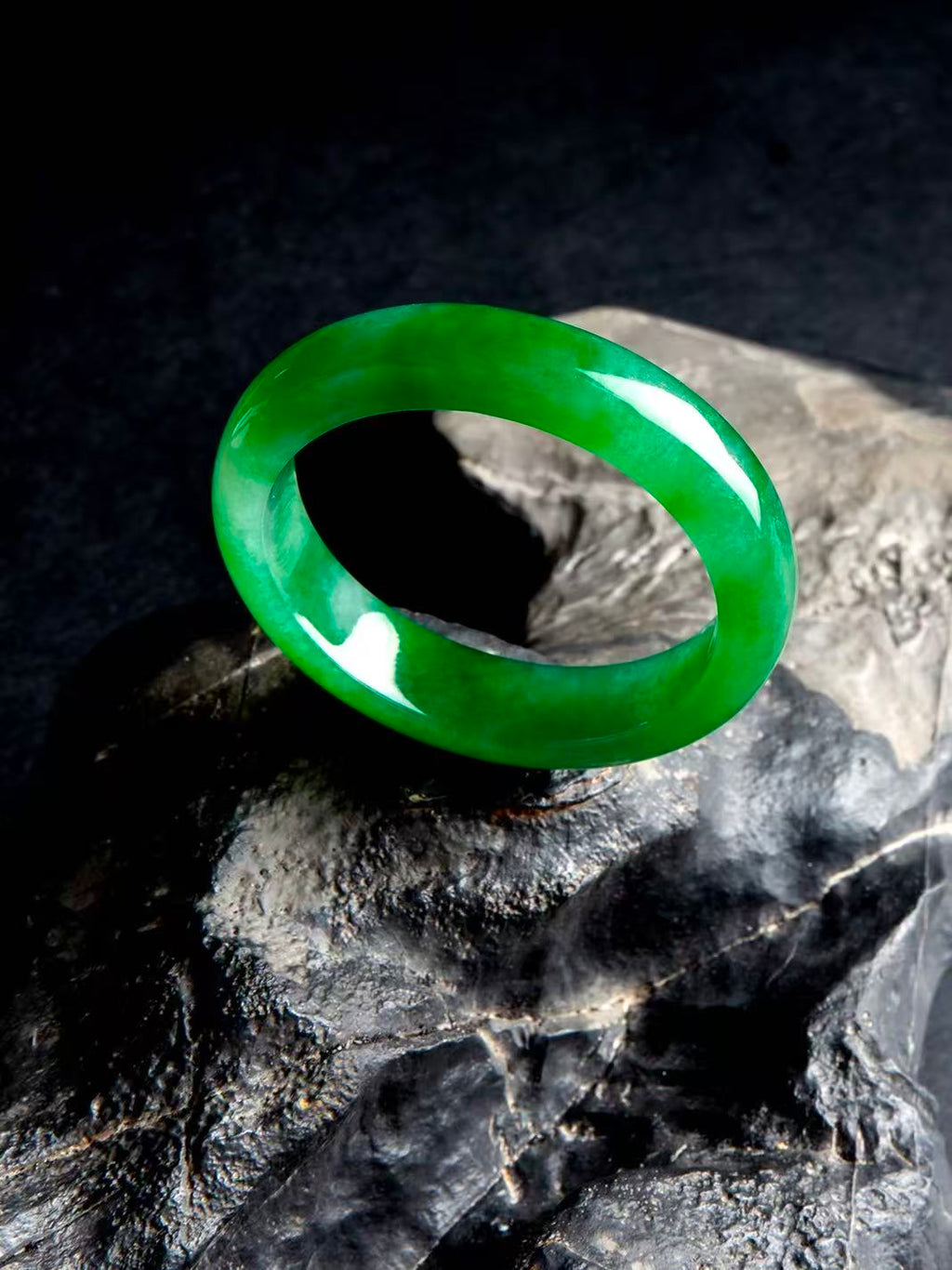 Natural Burmese jadeite bangle in vivid green with translucent texture — view 6